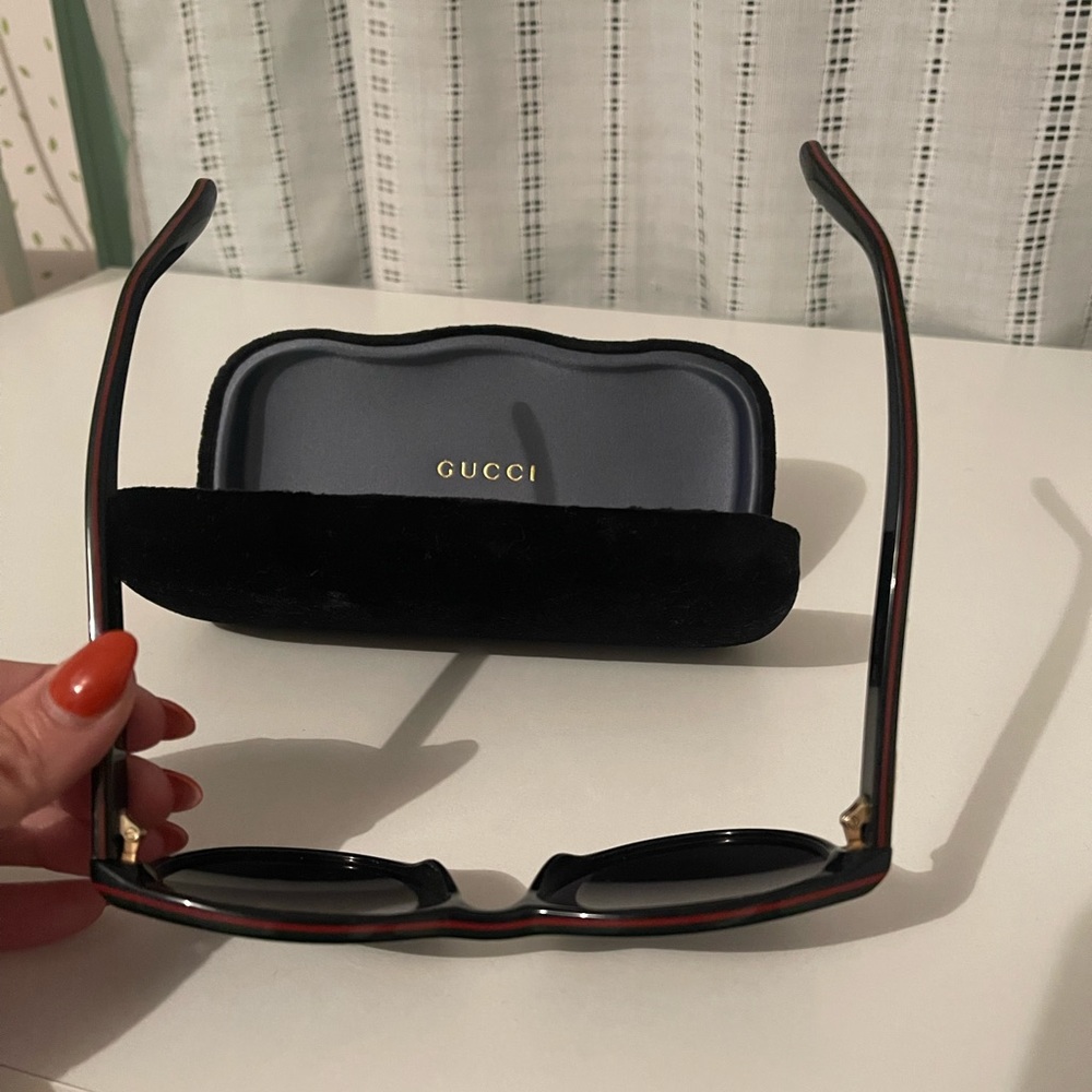 Black Gucci Sunglasses with red & green trim/Gucci logo on inner and outer band